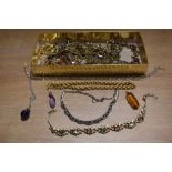 A variety of ladies costume jewellery, including amber glass pendant and necklaces.
