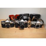 Three Praktica cameras. A Praktica Super TL body, a Praktica TL2 with Pentacon 1,8/50 lens and a