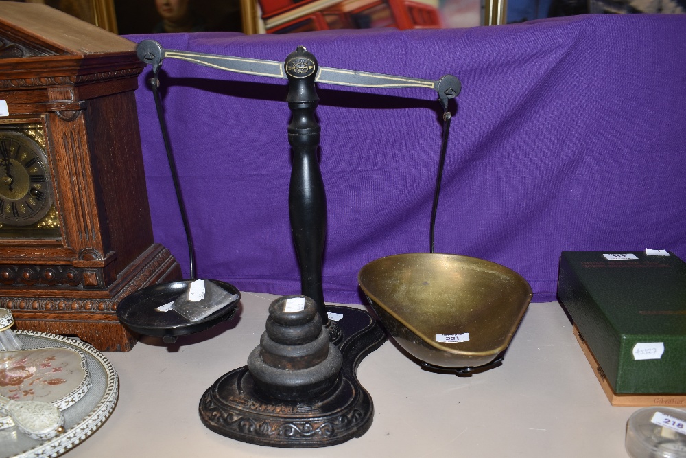 A set of late 19th/early 20th Century cast iron Salter balance scales, with gilt painted decoration,