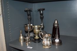 A pair of Victorian pewter candlesticks, 26cm tall, a cranberry glass sugar sifter, plus assorted