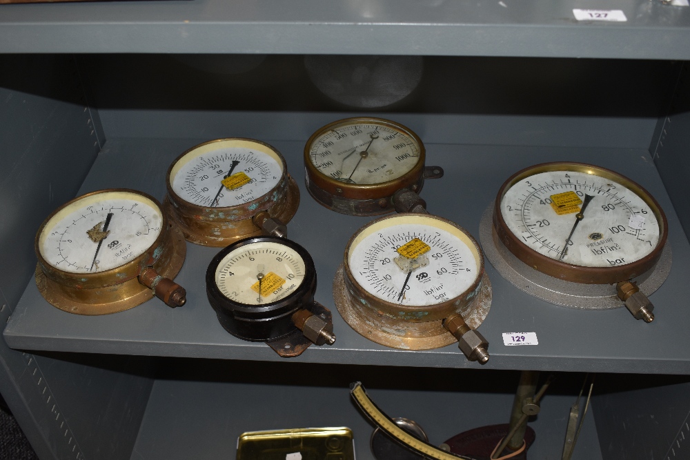 Six brass and metal pressure gauges