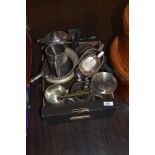 An assorted collection of silver plated ware, including tankards, sauce boats, and jugs