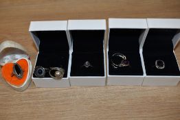 Seven silver and white metal rings of various forms including modernist, amethyst, marcasite etc