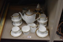 A Mayfair china tea service on cream ground with gilt trim, a green Wedgwood jasperware jug, and a