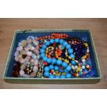 A box of assorted costume jewellery, to include modern plastic and multicoloured jewellery,