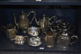An assorted collection of continental style silver plated ware, including coffee pots, scallop