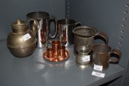 An assorted collection of metalware, to include pewter measures and tankards, and copperware