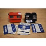 Two vintage Viewmaster Stereoscopes and a selection of slides.