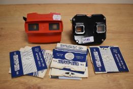 Two vintage Viewmaster Stereoscopes and a selection of slides.