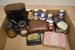 A collection of miniature character jugs, Lemaire opera glasses, playing cards, and oriental boxes