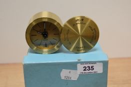 A 20th century portable pocket size clock or watch by Tiffany having brass case and Arabic inscribed