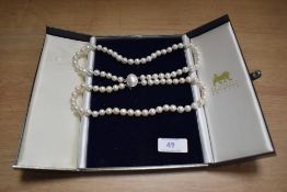 A string of simulated pearls with 925 stamped clasp