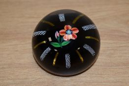 A Paul Ysart lamp work paperweight, having central flower surrounded by opaque multi spiral twists