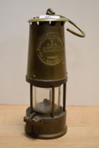 A 20th Century Eccles Type 6 miner's safety lamp, measuring 25cm tall