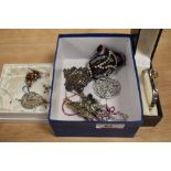 A collection of costume jewellery, including an iridescent enamelled butterfly brooch, a white metal
