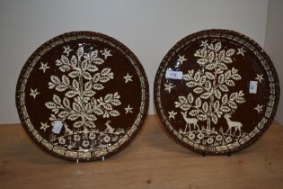 Two Victorian earthenware glazed flan dishes decorated with deer and trees, diameter 27cm