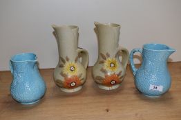 Two pairs of mid-20th Century jugs by Wade and Brentleigh Ware, the largest measuring 21cm tall