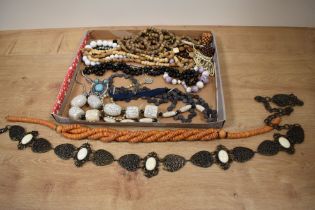 A selection of beaded necklaces, including rustic styles.