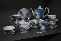 A Japanese tea set, on blue ground, and comprising teapot, milk jug, sucrier, teacups, and saucers