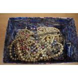 An assorted collection of simulated pearl necklaces, including a multicoloured bead necklace