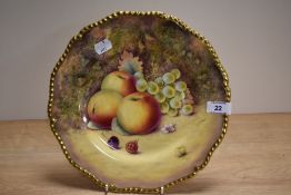 A 20th Century Royal Worcester hand painted Fruit Study plate, signed P.Platt, and heightened with