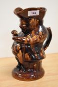 A Victorian treacle glazed character jug, of Rockingham style, measuring 24cm tall