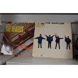 Two vintage vinyl records, 'The Beatles', comprising 'Help' and 'Please! Please!'