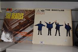 Two vintage vinyl records, 'The Beatles', comprising 'Help' and 'Please! Please!'