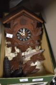 A 20th Century Black Forest style cuckoo clock with acorn weights