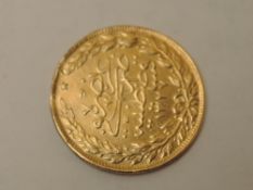 An Islamic Gold Coin, approx weight 7.2g