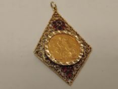 A 1901 Queen Victoria Gold Sovereign, Old Head, Melbourne Mint, in yellow metal and ruby pendant
