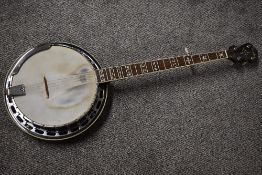 A Fender Remco resonator style banjo, serial number KD04020345, wuth gig bag and ply shipping case