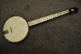 A vintage banjo, headstock with remains of Broadcaster label, mother of pearl effect fingerboard,