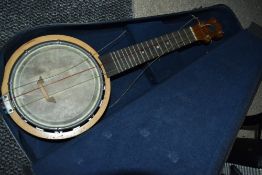 A vintage Keech Banjolele, stamped serial number B 10461, open back with signature to back