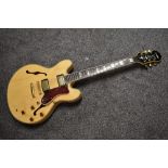 An Epiphone Sheraton, in natural finish, Korean, serial number 98090395, 1998, with Warwick gig