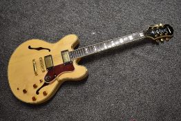 An Epiphone Sheraton, in natural finish, Korean, serial number 98090395, 1998, with Warwick gig