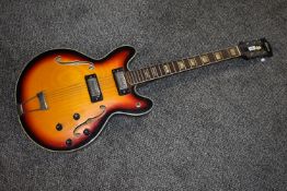 A vintage lawsuit period Antoria Twincaster electric guitar, similar to the Gibson 335, with trapeze