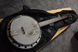 A Deering goodtime banjo, resonator style, with Warwick rockbag and ply shipping case