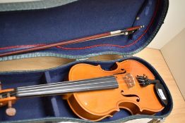 A modern half size violin labelled Stentor , made in Romania, with bow and croc effect case