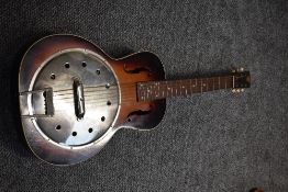 A vintage resonator acoustic guitar, with f holes , very plain resonator with Radio Tone stamped