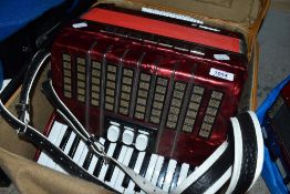 A Delicia Junior accordion , with case