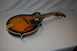 A Richwood mandolin having sunburst finish
