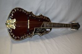 An unbranded Octave Mandolin/Mandola having wine read finish with extensive mother of pearl inlay
