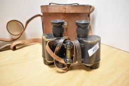 A pair of Wray, London binoculars No 6E/293 marked with crown and letters AM in original leather