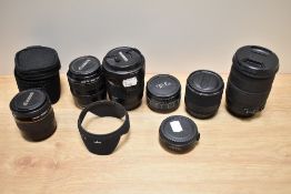 A selection of lenses. A Canon Zoom EF 28-105mm 1:3,5-4,5 lens, a Canon Zoom EF 35-105mm 1:4,5-5,6