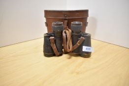 A pair of Huet, Paris 8x30 binoculars in leather case
