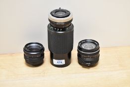 Three Vivitar lenses. A wide angle 1:2,8 28mm, a wide angle 1:2,8 35mm lens and a Macro Focusing