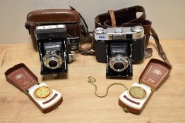 Two Zeiss cameras. A Zeiss Ikonta folding camera with Novar-Anastigmat 1:4,5 75mm lens and