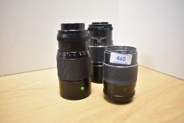 Three Chinon lenses. A 1:2,8 135mm and two Auto 1:3,5 200mm