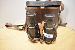 A pair of Groos, London X8 binoculars in a leather case